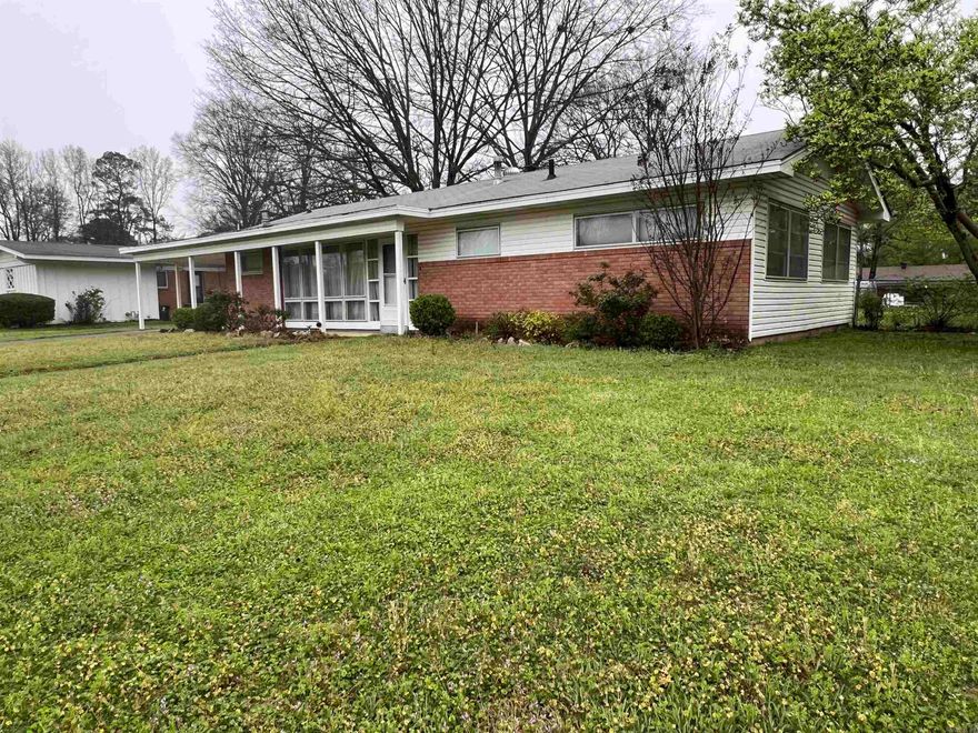 Welcome to 1908 Center Street, a classic single-story home located in the heart of Arkadelphia, AR. This property exudes timeless charm, starting with its attractive façade framed by mature trees and well-maintained lawns. Positioned on a generous plot, the home offers ample outdoor space, featuring a sturdy storage shed and a fully fenced backyard that provides privacy and security. Outdoor enthusiasts will appreciate the ample yard space, inviting for activities or gardening, and the potential to personalize the landscape to fit one’s tastes.  Upon entering the residence, you are greeted by a spacious living area, boasting natural light that filters through large windows. The expansive room, showcasing durable laminate flooring that mimics hardwood, provides a versatile canvas for any interior design palette whether for social gatherings or quiet relaxation. The floor plan seamlessly transitions to other parts of the home, suggesting an ease of flow that is ideal for modern living.  This home is primed for residents seeking a blend of classic layout with opportunities for customization. With its solid construction, spacious interiors, and substantial backyard...