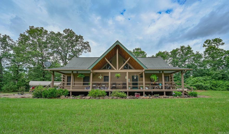 Searching for a turn-key country oasis? Take a look at this spacious, custom built, traditional LOG CABIN! Situated in the beautiful Oden area, this property includes 31 acres of both pasture and forest land. You’ll first notice an expansive, welcoming front porch just waiting to be enjoyed! Step inside and see the beautiful knotty pine interior and lodge like open concept layout! Living area Features include gorgeous wood floors, high ceilings, and a WOOD PELLET STOVE. The kitchen is outfitted with new stainless steel appliances, a JennAir range electric stove w/ down draft, lovely wood cabinetry with expertly crafted pull out shelves, and granite countertops! The large Primary suite has new vinyl flooring, a walk in closet and an in-suite bathroom including a jacuzzi tub! The home features a lofted second story with 2 additional bedrooms! There is a screened in back patio to enjoy beautiful summer evenings. This property BORDERS NATIONAL FOREST on 2 sides! A CREEK runs from the National Forest through the property, adding even more value to this special property. There is also a 30x40 ft shop on the property. If you’re looking to escape it all in style, this is the spot!
