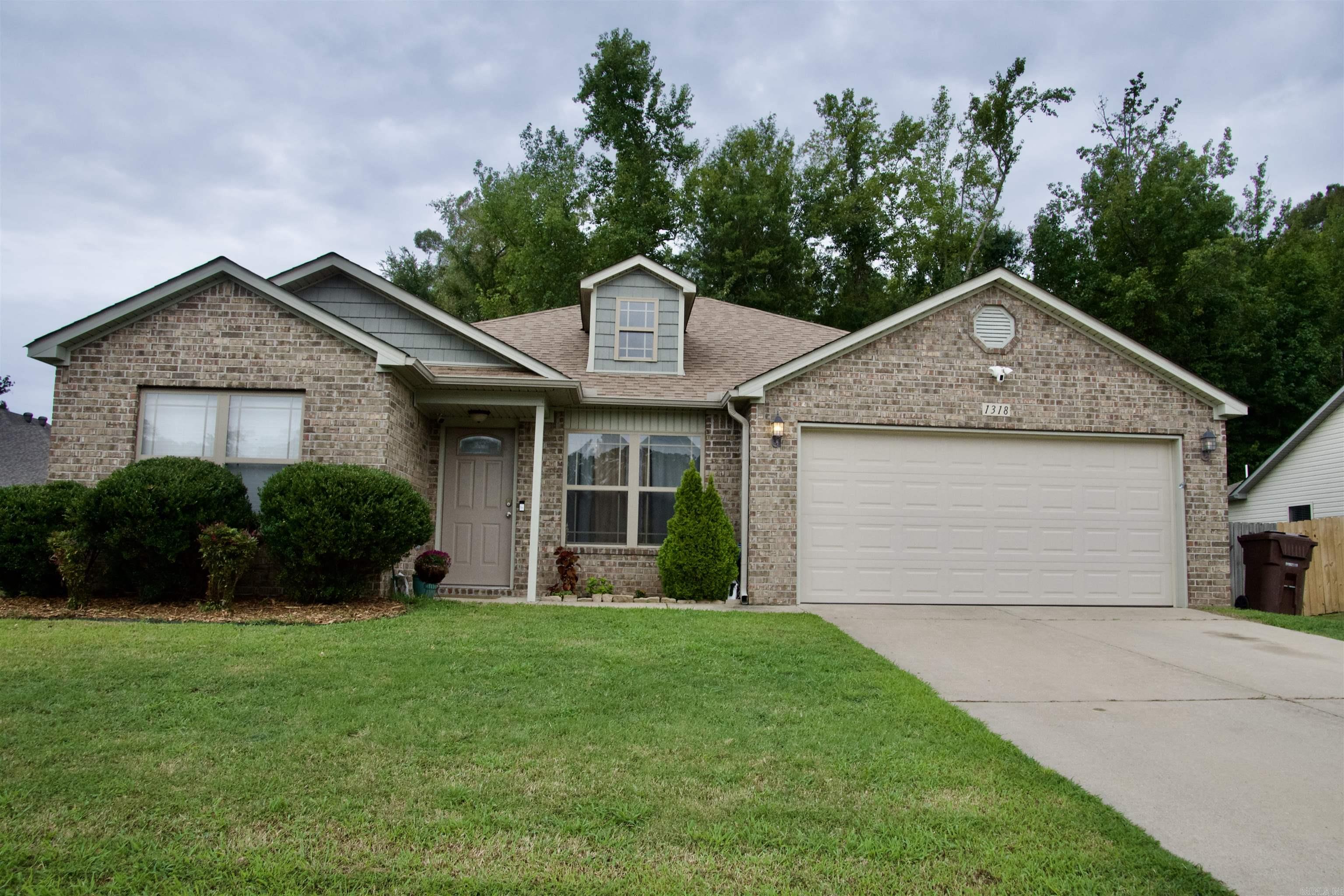 Are you looking for a home with a great price and an even better neighborhood that has a country living feel but close to Bryant and all the amenities of living in the city? Don't miss this spacious 4-bedroom 2 bath home that backs up to green space complete with a new roof. Enjoy preparing dinner or entertaining guests from your kitchen that is open to the large living room. The spacious primary bedroom with ensuite bathroom and large walk in closet affords privacy from the nicely sized additional rooms that can serve as 3 bedrooms or 2 bedrooms and an office. This won't last long... call or text today!!