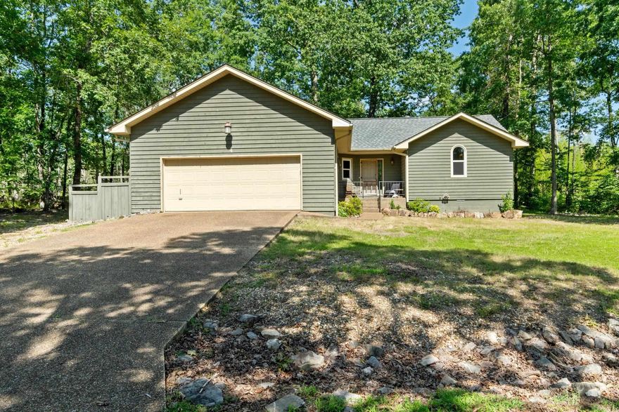 INCREDIBLE opportunity to purchase this home with a 2.25% assumable interest rate!  This charming home showcases a rustic interior that perfectly embodies the Arkansan lifestyle. With 3 bedrooms, 2 bathrooms, and a generous additional room ideal for a den or extra bedroom, it offers both comfort and versatility. Step outside to a spacious back deck, all nestled in a peaceful, wooded neighborhood in beautiful Hot Springs Village, surrounded by 9 golf courses and 11 pristine lakes. Enjoy the perfect blend of privacy and natural beauty!