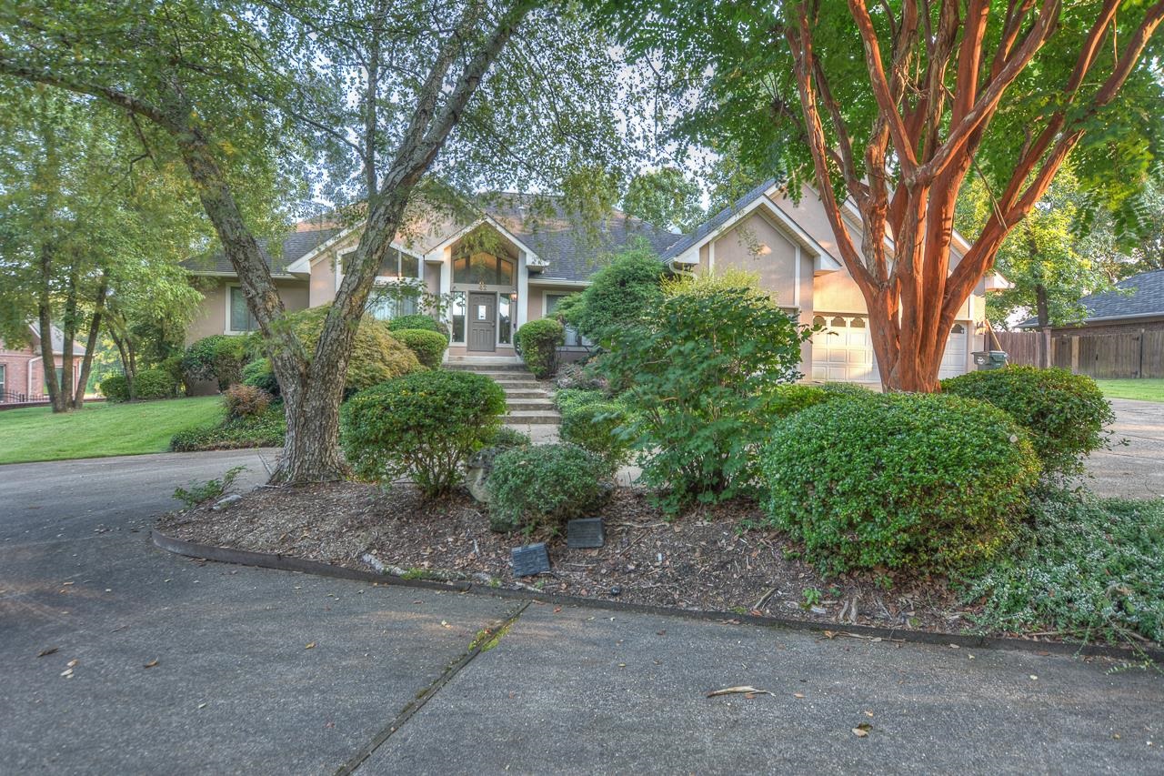 What you have here is stunning architecture and a dream lot on Lake Hamilton in the fantastic gated neighborhood at Stonegate. With nearly 4,600 square feet of space, the sprawling two-level house is lined with ribbon walls of glass that lead out to terraces that seem to be everywhere. The impeccable taste of this owner can be yours, & it also includes a covered two-stall boat dock, one hydraulic lift & seadoo pad