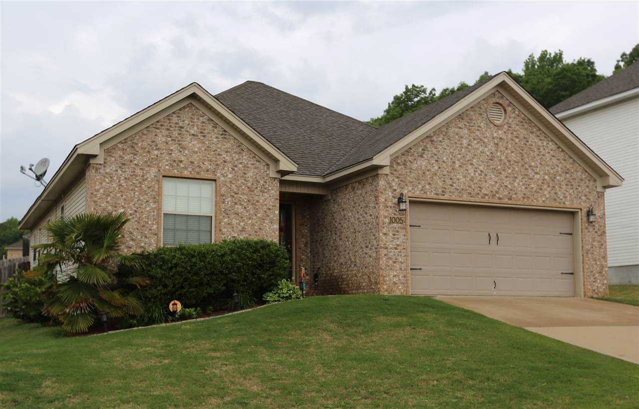 Many features to admire in this beautiful home. High ceilings in the entry and living room with electric log fireplace and hardwood flooring. Stainless steel appliances in the kitchen. Nice master suite includes luxury bath with jetted tub and walk in shower. Relax on the nice covered patio overlooking the backyard with a waterfall water feature.