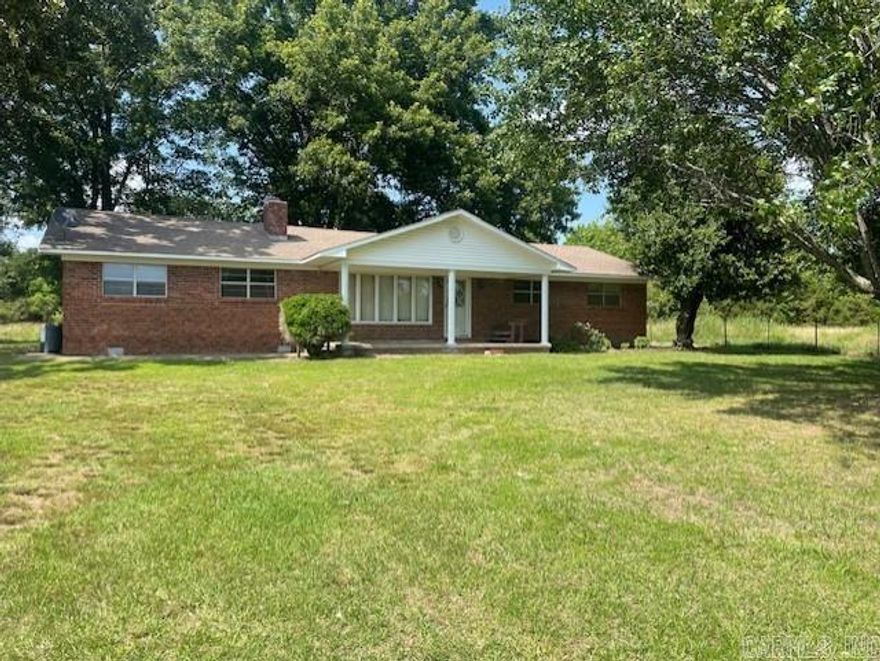 Peaceful country setting. Spacious all brick ranch style home with acreage. This 60 year old home is in good condition and ready for your updates! Majority of the flooring has been updated already. 3 BR 2 BA, spacious eat in kitchen and great room, mud room, and a "FLEX" room. SO many possibilities with this flex room since it has separate entry to the outside. Game room, man cave, craft room, home office, small business, teen room, inlaws ????? Home is being sold with approx 4.7 ACRES. Existing survey available. Existing pole barn and fencing in place but would need some attention.  Home is priced and sold AS IS condition.  AGENTS see remarks.