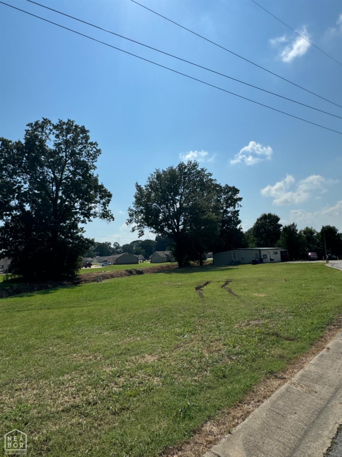 Prime commercial corner lot located at the intersection of Stadium Boulevard and Summer Place in Jonesboro. This 0.43-acre parcel, approximately 18,731 square feet, is zoned C-3 and offers excellent visibility, accessibility, and development potential. Its corner positioning along one of the city's most traveled corridors makes it ideal for a variety of commercial uses including retail, office, or service-based businesses. City utilities are available, and the property is not in a designated flood zone. This is a rare opportunity to build in a growing commercial area with strong traffic flow and high exposure.