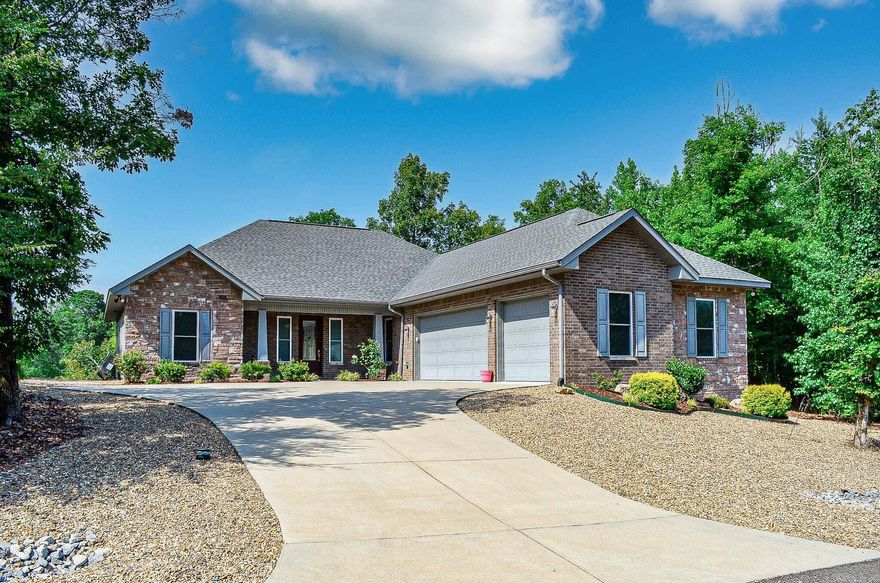 Walking into this custom beauty will meet with all the comforts you desire. From a full service island, cabinet pull out drawers, and the enjoyment of a 6 burner gas cooktop, you will be overwhelmed at this lovely home! Great Kitchen Aid appliances with wine fridge! The great open concept floor plan and split bedrooms, will provide you with much needed space.Complete with an additional office and generous laundry room.  Its welcoming colors will invite you right in with all of your personal things and make you feel right at home. You can entertain right out the back door or watch the deer as they go by. The views of the Saline river from wonderful home are breathtaking! This won't last long with its 3 car garage, complete with fabulous workshop area complete with cabinets. Rainbird sprinkler system and 500 gallon gas tank buried for all your convenience along with the gas water tank.