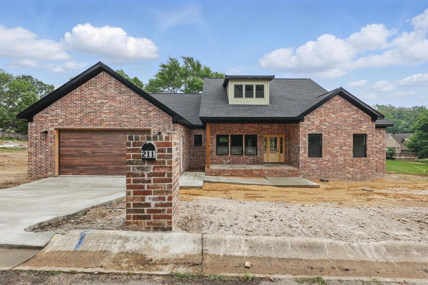 Welcome home to this show-stopping new construction in the highly sought-after Hills Subdivision! This 3-bedroom, 2.5-bathroom home is designed to impress with its beautiful brick exterior and inviting covered front and back porches—perfect for enjoying peaceful mornings and relaxing evenings. Step inside to a thoughtfully designed split floor plan featuring tray ceilings that add a touch of elegance and spaciousness. The kitchen is a dream, boasting gorgeous quartz countertops and a walk-in pantry for ample storage. The primary suite is a private retreat, offering a luxurious ensuite bath and a large walk-in closet.Located just minutes from Lakeside Schools, this home offers both convenience and style in a prime location. Don’t miss your chance to own this stunning new build—schedule your showing today!