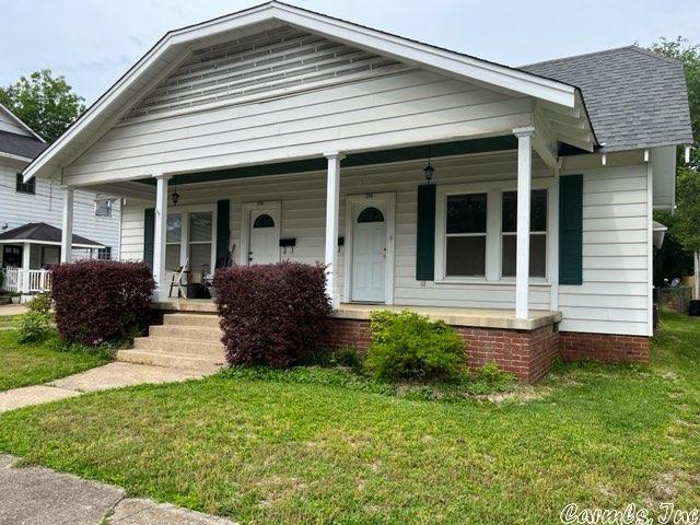 Located only half a block from the Ouachita Baptist University campus, this is a perfect investment for either a very nice duplex or potential single-family home. With high ceilings and much interior character, this property is located in one of Arkadelphia's coveted neighborhoods. It has been upgraded with new wiring, plumbing, and central H/A systems. Each side comes with a stove, fridge, washer, and dryer. The welcoming front porch adds character, and the yard is easy to maintain. The back yard has a desired privacy fence and a detached two-car garage. Sixteen inches of attic insulation helps lower heating and cooling bills, and siding makes for low maintenance.