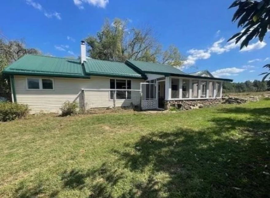 Three-bedroom home on six acres m/l has a live stream flowing through the property. There are established pastures for large livestock.The deep well was recently serviced and the septic system too. Home features custom wood doors throughout and a vaulted wood ceiling in common areas. The dining room has a heavy iron woodstove that you can also cook on with the distinction of having been built right here in Yellville Arkansas. Home has a metal roof and vinyl siding for ease of maintenance. Home has central heat (propane) and air-conditioning.