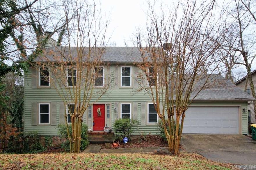 Lovely family home on cul-de-sac.  Den with built-ins and new wood flooring in Feb 2014.  New insulated windows and vinyl siding in 2011 as well as new roof in 2010.  Eat-in kitchen and large dining room. Half bath and Laundry on main level. Private large wooded lot with huge backyard and beautiful views off the wood deck.  Master suite with walk-in closet and separate vanities upstairs as well as two other nice sized bedrooms and bath.   Sprinkler system, alarm and new paint! Come see!