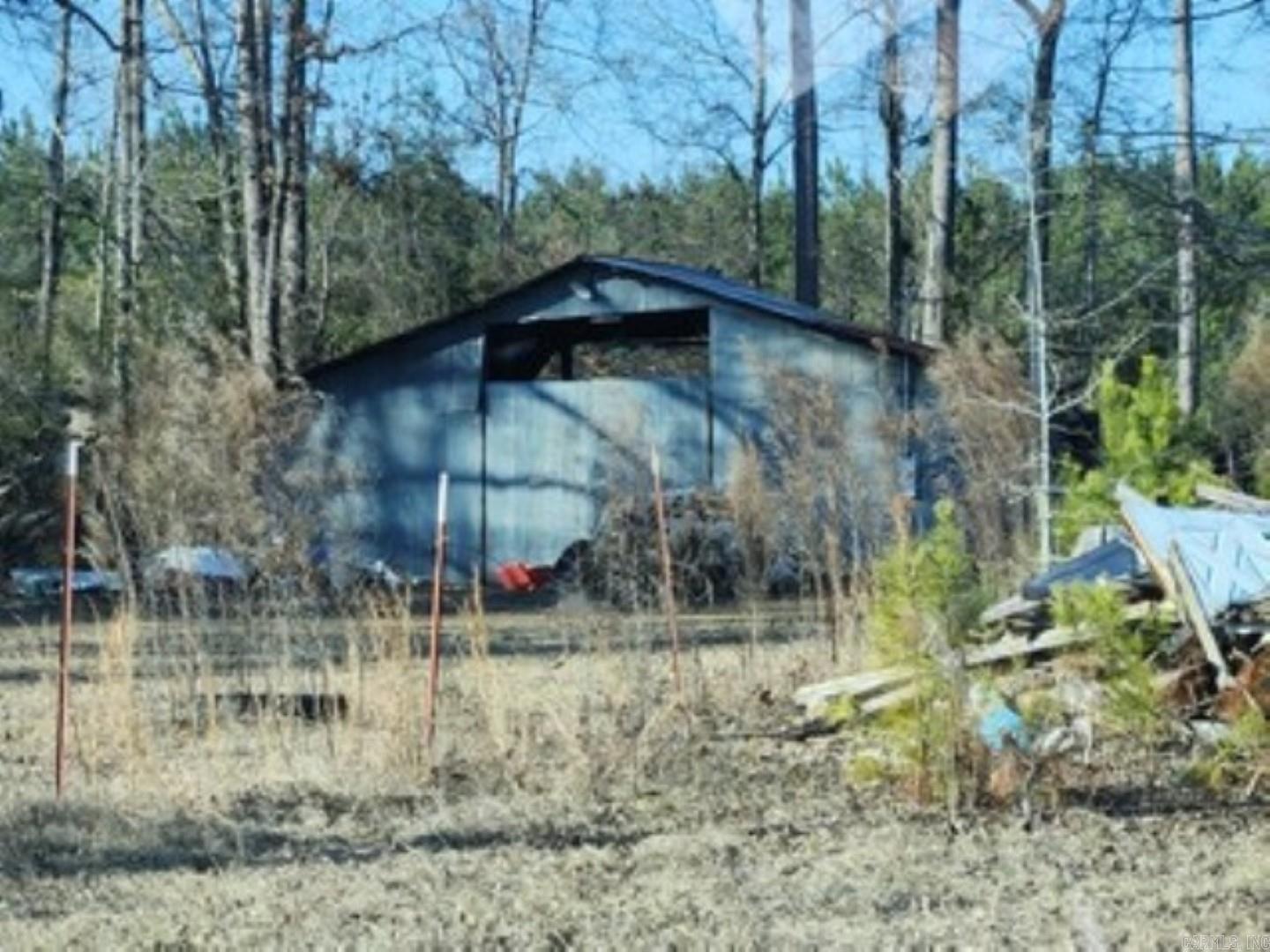 .45 acres of land with old shop on it would be good for building or a mobile home.