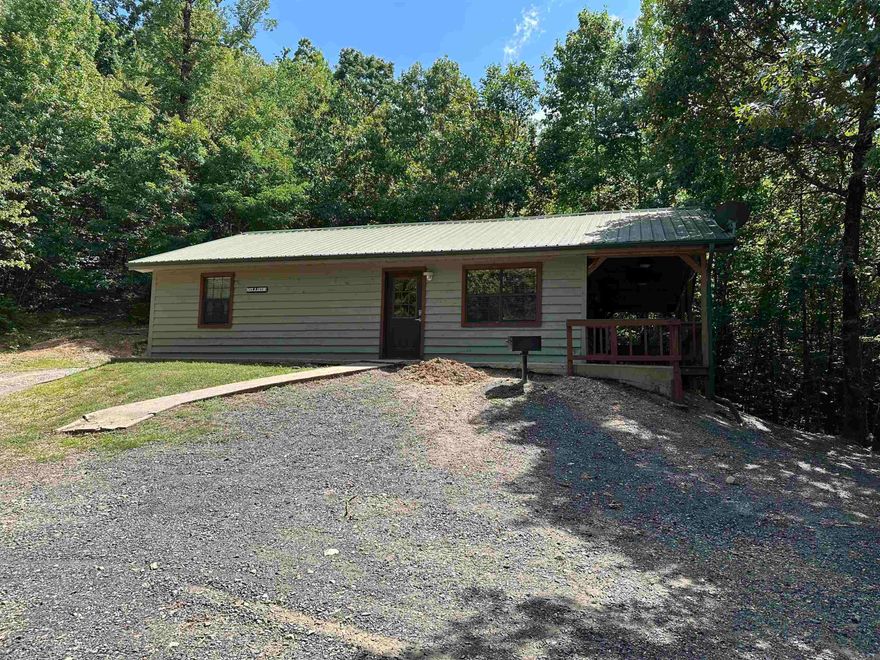 Live bordering the National Forest in the Ouachita Mountains! Nice Cabin in the woods boarding National Forest in Mena Arkansas right in the middle of Heath Valley in the Wolf pen Gap trail system! The location is amazing! There a two spacious bedrooms and two full bathrooms! The open concept living and kitchen area has vaulted ceilings and there is a nice deck with double doors leading outside! This can be your perfect vacation home or short term rental or main home! Close to creeks too! Has only ever been used as a short term rental! So much potential!