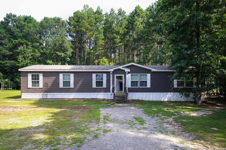 Over 6 acres on a private street with only a handful of other homes, this country haven offers plenty of room for hobbies or animals. You can access the guest bath through the wet room at the back door after those long days of working outdoors.  This home has 4 bedrooms, 2 baths, a large open concept plan with a second living area near the guest rooms. Schedule your showing today!