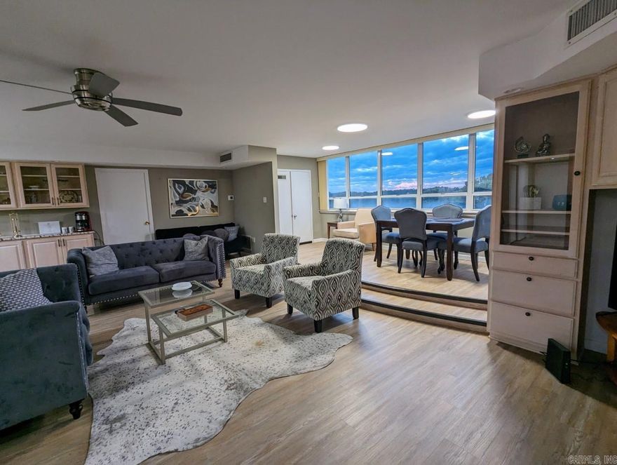 Beautiful furnished lakefront condo with a covered boat slip in the only high-rise on Lake Hamilton. Plenty of space to enjoy views of the lake from every room and a dedicated work space. This condo is a unique gem; formerly 2 separate units, now a huge, upgraded two bedroom unit. Beacon Manor is a Resort type property on Lake Hamilton. Enjoy the Grounds, picnic and grill areas, workout and rec room, and the beautiful large lakefront pool. Short Term Rental city license in place and will transfer. This condo also makes a great living space for trouble free living.