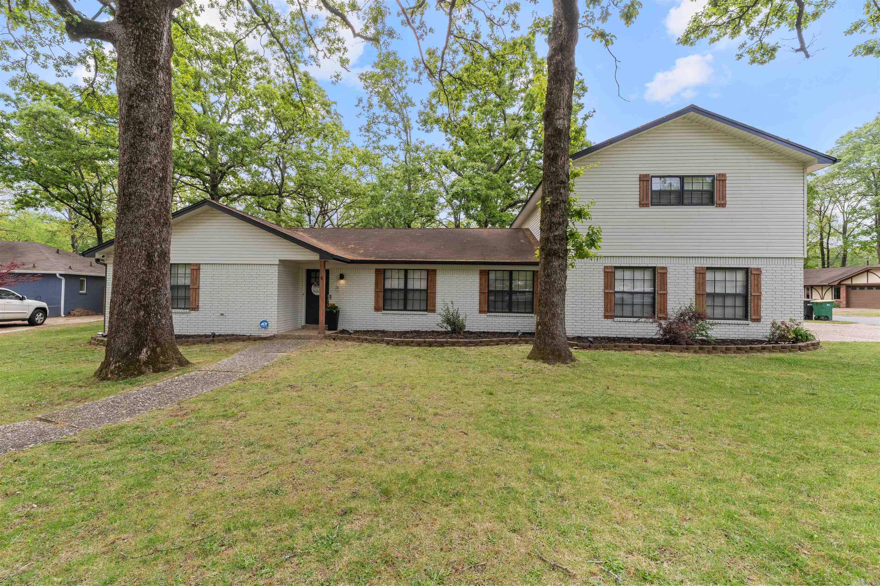 NEW ROOF AT CLOSING!! Boasting over 2600sf and tons of character this home offers 5 bd and 3 full baths with tons of updates. Enter into an open living/dining/kitchen bringing the whole family together. Off the kitchen theres bonus space that could be used as a breakfast nook or designated office. Sliding glass doors off the living room leads to a unique patio area making entertaining a breeze! Main floor has the primary bedroom with a full bath offering a double sink vanity and a sliding glass door for access to the patio, 2 guest rooms, another full bathroom with easy access from the living area, and a huge laundry room with a sink and bonus space. Upstairs you will find 2 more bedrooms with a Jack and Jill bath. Every room has amazing closet space built out to utilize its full potential. Granite in the kitchen w farmhouse sink & pot filler above stove, 2 baths fully renovated, new flooring, updated light fixtures, full exterior paint and trim work completed in 2022. Tankless WH! The oversized backyard has a large shop with bay door and a smaller shed with electricity. All of this within walking distance to Henson park. Walk the trails & play pickleball! SEE AGENT REMARKS!