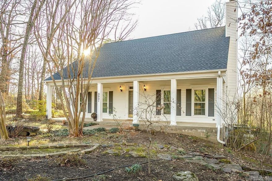 Incredible views, spacious rooms, and abundant storage - what's not to love? Don't miss this elegant, traditional charmer tucked away in a quiet cul-de-sac on a wooded lot. This gracious home features gorgeous wood flooring, beautiful new carpeting, and tile floors. The main floor has an inviting living area with a wood-burning fireplace to bring a touch of cheerful coziness to a chilly day. The eat-in kitchen has plenty of bright white cabinets, a big kitchen island that has seating for four, a pantry cabinet, and ample room for a kitchen table. Extending the entertaining space is a beautiful formal dining area with a great view. The main floor also features an incredible 19' x 18' sunroom with an abundance of windows all around, plus skylights. You feel as though you're in a very sophisticated tree house! The roomy primary bedroom has a generously sized walk-in closet, and a nice en-suite bath with an extra-large tub as its centerpiece. Two more bedrooms and a second full bath provide plenty of room for guests or family. A laundry room connects the bedrooms and contains a third full bath. Upstairs you'll find an extensive bonus room, and two spacious bedrooms each with deep stora