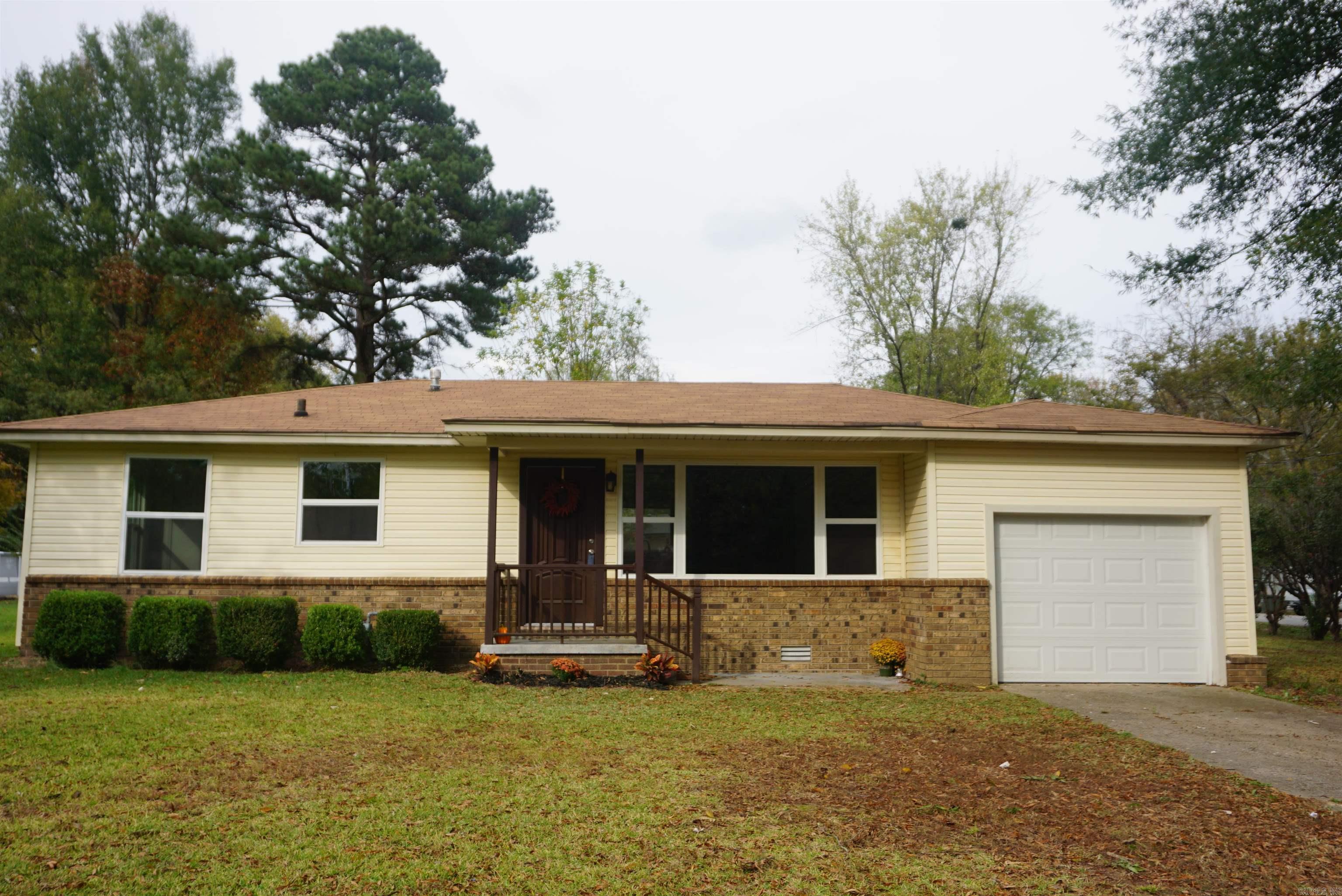 Super cute 3 bedroom house with an enclosed garage and new windows, new flooring throughout, new light fixtures, and freshly painted inside ! Very open living dining kitchen, lots of countertop space, new stainless appliances in the kitchen and the Refrigerator and Washer/Dryer Combo machine stays. Nice size laundry room with storage cabinets and a folding cabinet plus storage underneath that. Back door goes from the laundry room out to the fenced in back yard and there is a driveway that goes from the side street to the back yard. Bedrooms all are good size and have nice closets. Bathroom has a nice large vanity and a great linen closet. Not far from the freeway, and close to the School.