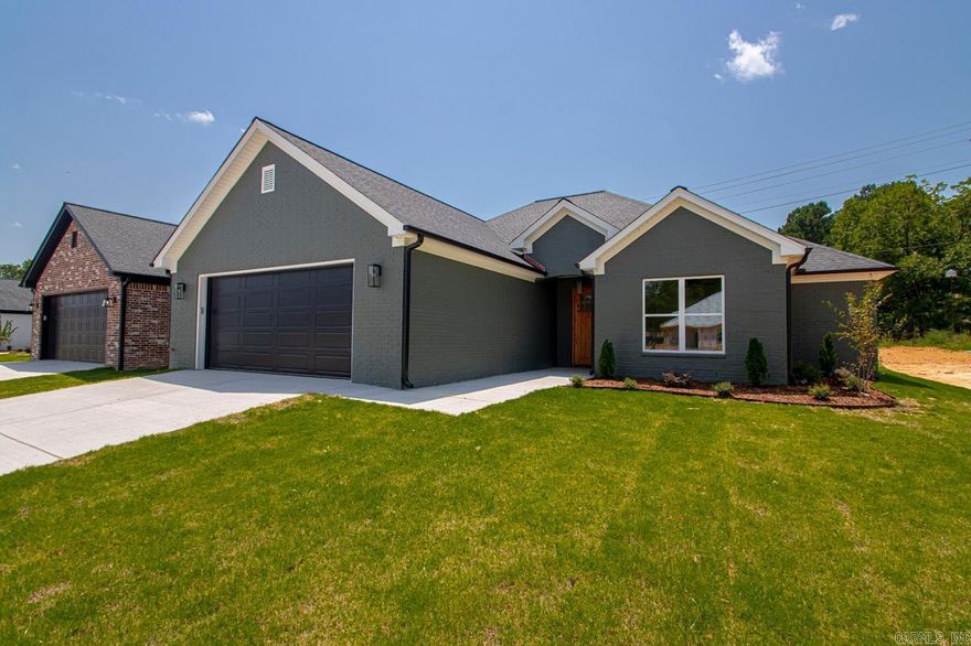 New Construction home conveniently located to the interstate and shopping!  This house has 10 foot ceilings in the living room & foyer.  Living Room has gas log fireplace, built-ins, floor outlet, & large windows. Kitchen & Living Room are open to each other.  Kitchen has quartz countertops & stainless appliances. Bedrooms are separate.  Large Guest bedrooms with 9ft ceilings that are separate from primary bedroom.  Large laundry room w/counter space.  Primary bedroom has tray ceiling, large windows.  Primary bath has double vanities, soaking tub, tile shower, & lots of cabinet space!  Primary bath flows into large primary closet!  The backyard has a nice patio that overlooks a neighboring pond!  Other features include tankless water heater, LVP flooring, tile, OVERSIZED GARAGE, & customized finishes! Open every Sunday!  Agents see remarks!