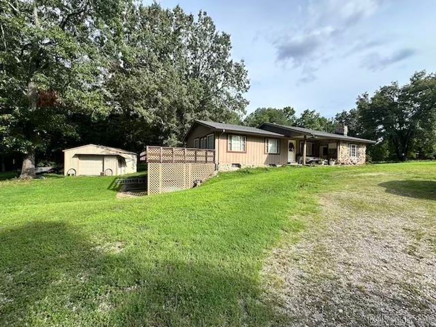 Country living close to town. Move in ready 3 or 4 bedroom, 2 bath home on 2.41 acres (m/l) offering the the perfect balance of privacy, space and convenience. Located just 3 miles from Walmart and only 2 miles to Norfork Lake, this property provides a rare opportunity to enjoy peaceful country living without sacrificing access to amenities. Inside, you'll find a spacious layout with a comfortable living room, separate family room and an updated kitchen. The full walkout basement includes tons of storage, a 2nd kitchen and living area. Outside, you'll find a large, spacious fenced in backyard - perfect for pets or kids. A chicken coop with an attached run and extra fenced in area for them roam. Solar powered automatic door for added safety. A 20x20 detached garage, a large carport for extra parking or boat storage. New roof February 2025 Home comes with 1 year Home Warranty for added peace of mind. Well and City Water on property. This property won't last long, book your appointment to look today.