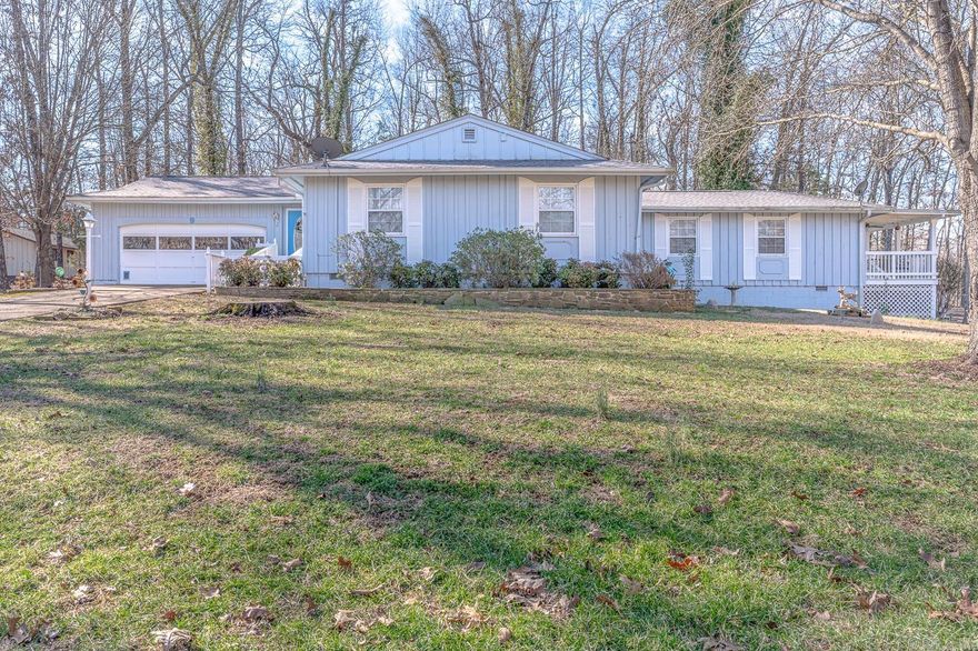 Welcome to Market 9 Ouachita Road of the Kima First Subdivision in Cherokee Village. Situated on .69 +/- acres featuring a corner & adjacent lot with wood privacy fencing is a 1970s built Ranch Style Rambler wrapped in wood, topped with 2023 architectural shingles, and accented by shutters, gutters, a 2 car garage, and lovely landscaping. The interior features 2,024 sf of well laid out living space and includes an eat in kitchen & dining area w/ cozy wood burning fireplace, large living room with streaming natural light and access to the covered patio, Master bedroom w/ en-suite that features a walk-in shower and walk-in closet, 3 spare bedrooms and spare bathroom with shower tub combo.  You'll love the storage, custom detailing, two 16 x 12 utility buildings, wooded & wildlife views from the deck, the proximity from the property to Cherokee Village lakes, South Fork River, and golf courses, and all the amenities the village has to offer.  Conveniently located near Highway 62/412 less than 10 minutes to Hardy and an hour and fifteen minutes to Jonesboro.  Call today to schedule your tour and make this house your home, home away from home, or next addition to your rental portfolio.