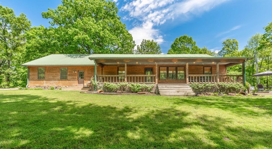 Escape to your own private sanctuary, accessed through a solar-powered gate and lengthy asphalt driveways. Nestled amidst lush surroundings, discover a charming cedar log home with a spacious open floor plan, elevated by high ceilings and an updated kitchen flooded with natural light. With a two-car garage and a dedicated safe room, every practical need is met without compromising on style. But the real gem? Step into the sprawling 7,000 sq ft under-roof shop – a haven for hobbyists and entrepreneurs alike. Imagine a fully finished two-story apartment within, complete with a kitchen, living area, bedroom, multiple closets and 1.5 baths. Whether hosting guests or seeking rental income, this versatile space offers endless possibilities. Embrace the serenity of your own slice of paradise, where modern comfort meets rustic charm. Virtual video of the property coming soon. Call or text for the video and for private showing of the property. Property is behind locked gates and will not be able to be seen without an appointment.