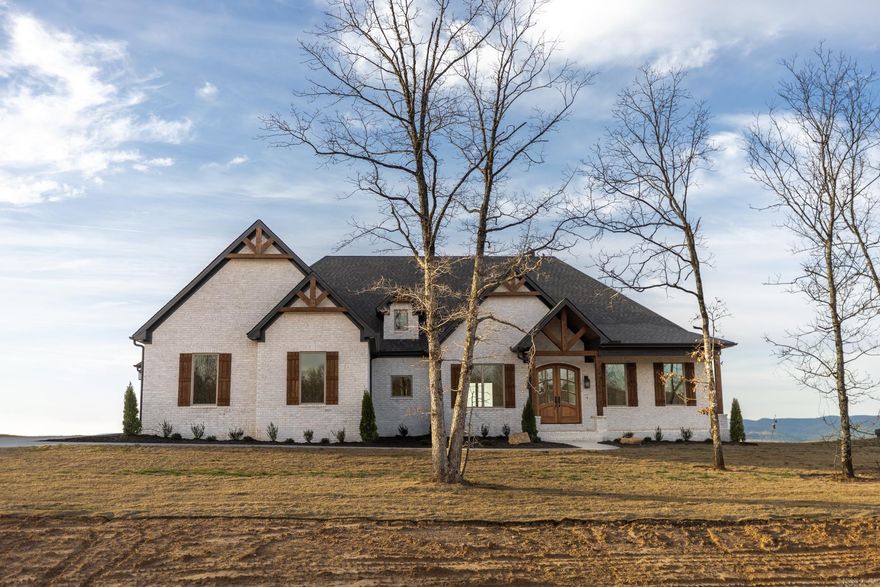 New construction home in the gated neighborhood Lakeview West. This neighborhood will soon be adding a sixty acre park with amenities such as a tennis court, football area, soccer area, basketball court, miles of walking trails, and a community bonfire area. The home itself sits on top of a ridge line overlooking Lake Maumelle, the Western mountain range, and a natural valley, while still able to have a large flat backyard. The house itself has incredible curb appeal with its front elevation being carefully crafted. The home is also designed to function with as much glass as possible on the back of the home to capture the million dollar views.