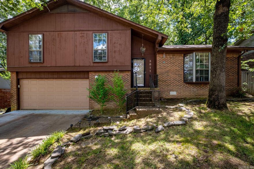 A lovely home with lots to offer including a great layout and large rooms. Comfortable living and dining on the main level with backyard access. Garage, laundry/mudroom, and additional backyard access just a few steps down. Primary suite with walk-in closet and full bath a few steps up, along with two additional bedrooms and a full bath. This conveniently located home is zoned for Don Roberts Elementary and will have you close to all West Little Rock has to offer, along with quick access to the interstate.