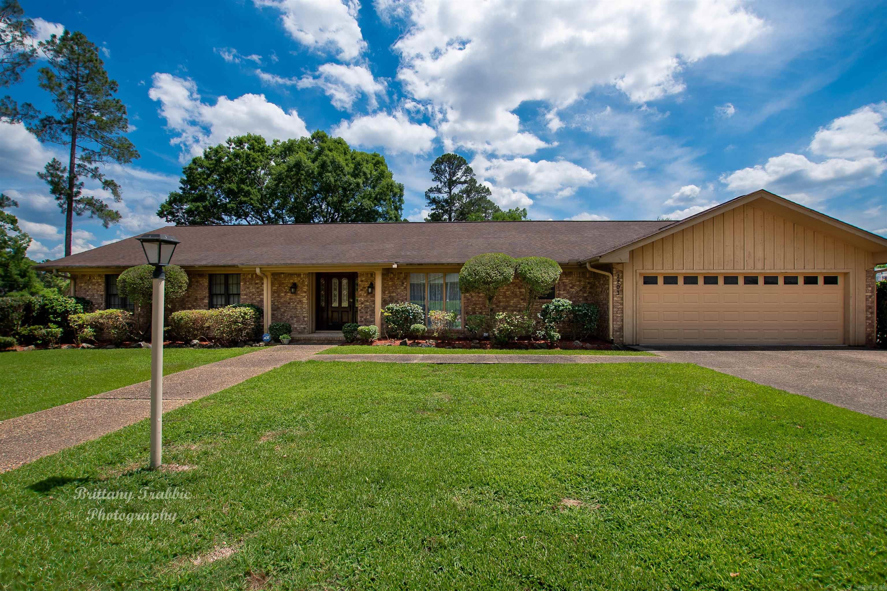 Generator to run whole house, sprinkler system, large area concrete storage under house - approx 800 sq ft, tankless hot water heater & 50 gal hw heater, open wet bar, large family room Downstairs - apartment with den, wood burning fireplace, 2 bedrooms, 2 baths, kitchen & utility area & elevator(will not warranty) This would make a great rental, guest area, or mother-in-law suite. It could even be a great home office House sits on a nice corner lot