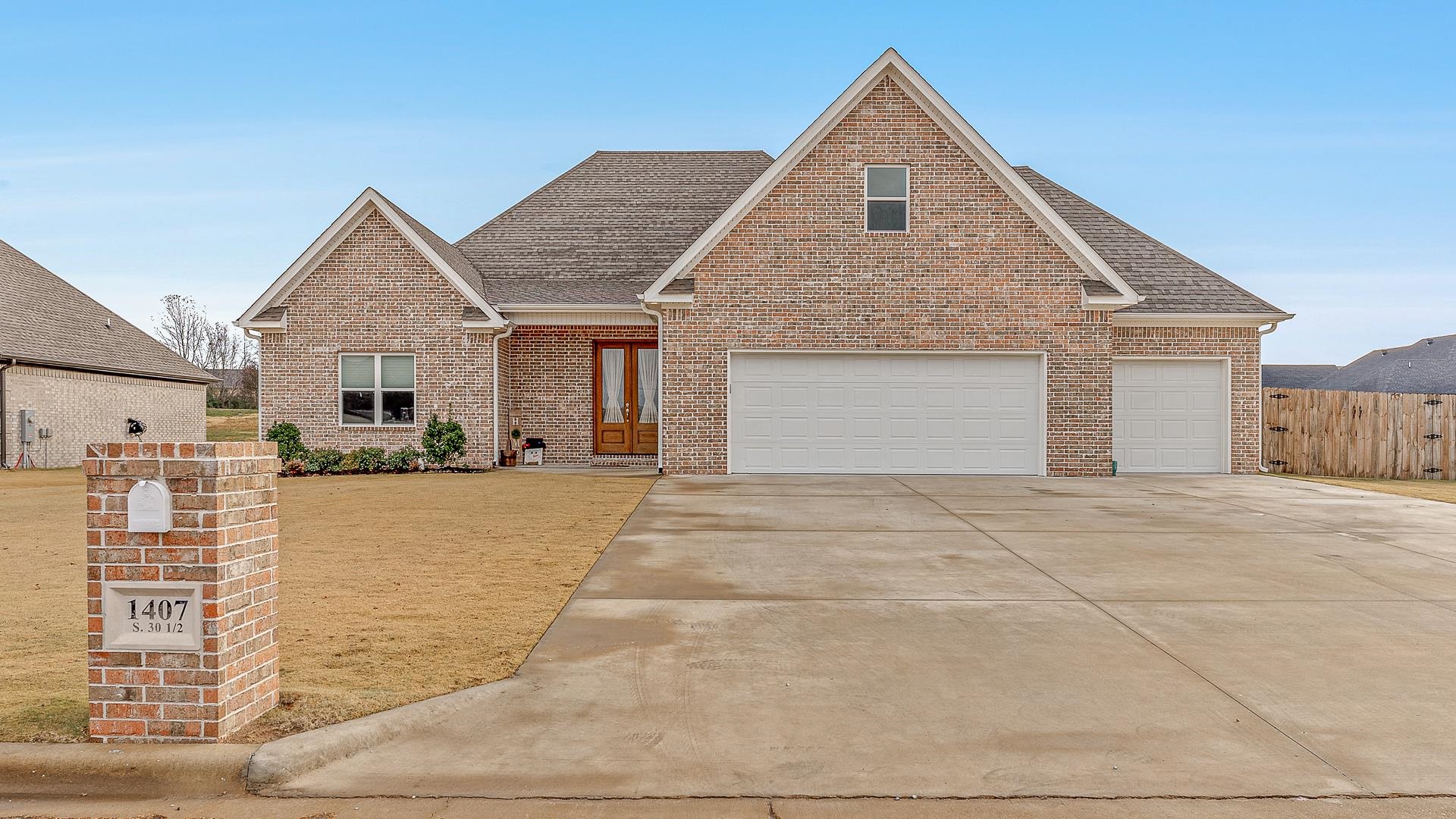 All Brick beautiful home with bonus and three car garage on a spacious corner lot, large sunroom makes a fabulous den for additional entertaining, all white kitchen with quartz countertops has an abundance of cabinets for storage, stainless appliances, great room and gas log fireplace makes this extra cozy for a modern farmhouse flair! A large Bonus room over the garage gives additional space with covered patio and fenced yard topping off this wonderful layout The Primary suite has a double tiled shower with seat, double vanities and double closets, including the laundry near by. Don't miss out on this Split bedroom arrangement in this open floor plan allows for guest privacy and the extra garage is a wonderful bonus when you are near the golf course or just need extra storage, call for your appt. today.