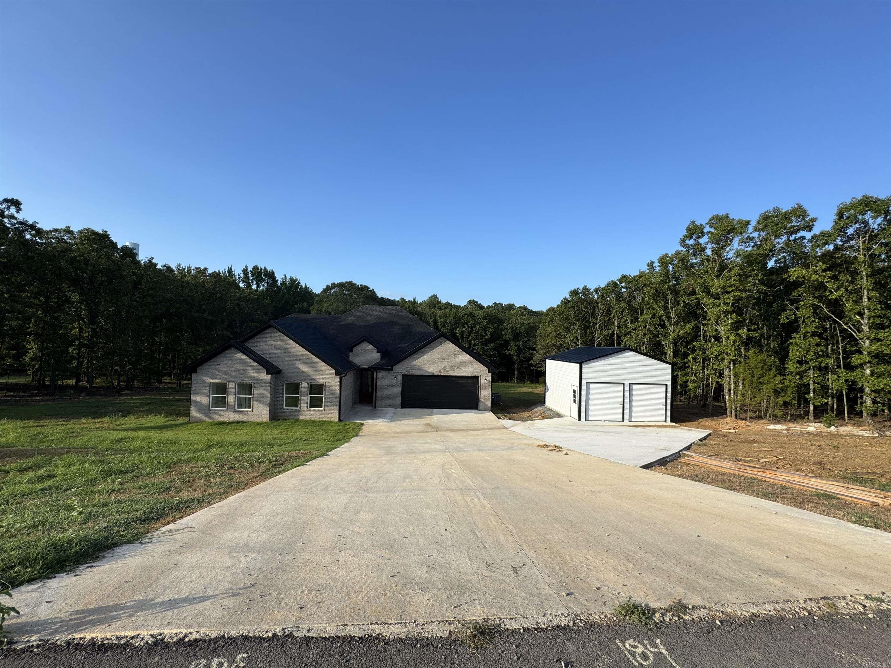 Welcome Home to this gorgeous country gated community! This Approx 3,098 sq ft home is a 5-bed (1 is large bonus room over garage), 3-bath boasting a split floorplan along with an ultra open concept! The living room, kitchen, & dining room were made to entertain! Come check this home out! This one is a looker! Entering the home one immediately notices the large foyer plus stairs leading upstairs. Ahead is the spacious living room w/a unique blend of light colored paints accented by dark wood stains for a perfect balance! Just off the kitchen is the pantry and on the left hand side resides 3-bedrooms downstairs. Back in the living room on your right is the master bed & bath as well as laundry room. Do not miss out on this stunner! Don't forget about the covered back patio w/tongue & groove ceiling overlooking the backyard w/trees! See Agent Remarks.