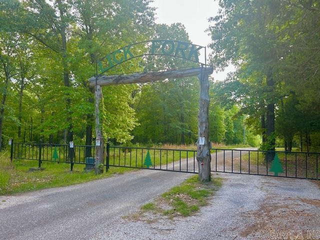 Your Ozark retreat awaits!!! This 3.35 acre lot m/l is tucked inside a beautiful gated subdivision just minutes from downtown Mountain View, AR-- known as the Folk Music Capital of the World. Enjoy live music on the courthouse square, float or fish for trout on the nearby White River, and take in the peaceful beauty of this serene setting. The property offers privacy, creek access just down the road and the protection of thoughtful restrictive covenants to preserve the charm and value of your investment. Come build your dream where ,nature, music, and small town charm meet.