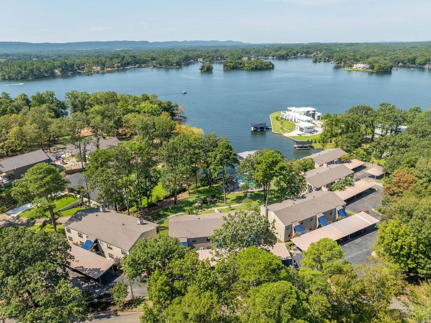 This is an immaculate 3 bedroom, upper level condo overlooking the main channel of Lake Hamilton!  Great location convenient to everything that Hot Springs has to offer!  HUGE COVERED DECK TO ENJOY ALL YEAR LONG ! 2 Car Covered Parking.  This is an absolute MUST SEE !!