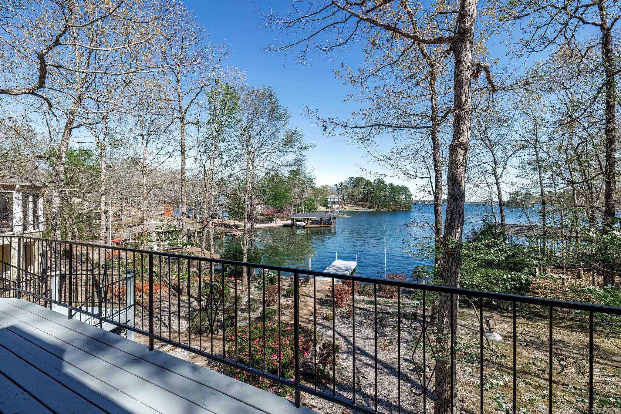 Nestled in the heart of HSV this Lake Balboa, 3-bedroom, 3-bathroom home offers the perfect blend of versatility & breathtaking scenery. From the moment you step inside, you’ll be captivated by the wonderful views that nearly every room has, showcasing the serene beauty of the lake and beyond. Whether you’re relaxing on the deck or unwinding on the private swim dock, you’ll have a front-row seat to the dazzling fireworks displays—a true highlight of this exceptional property. Spanning multiple levels, this home is designed for both comfort and functionality. The main living spaces include a primary suite w/ sitting spa tub & W/I shower. Dedicated office or 4th bedroom with a new deck to enjoy your morning coffee & lake views from the front and side yards. The possibilities don’t end there. Downstairs a workshop-golf cart garage offers plenty of storage and flexibility. 2 bedrooms down with den and another bonus room that could be another BD or craft room? This is a Wonderful Lake front family home with plenty of outdoor spaces and room to grow!
