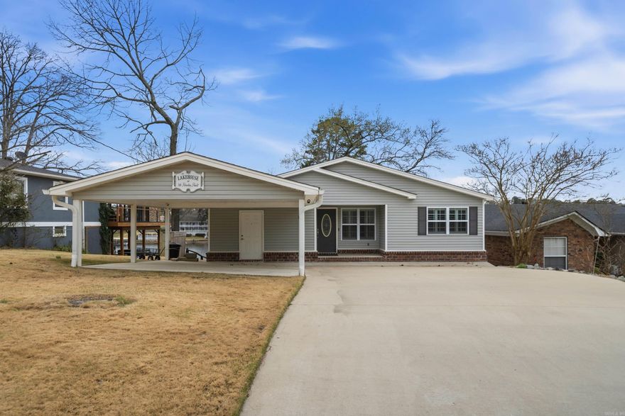 Easy Lake Living!  This newly remodeled 2600 Sq. Ft. 3 Bedroom 3 Bath home is the perfect place to relax, unwind and enjoy all the pleasures of lake life on beautiful Lake Hamilton.  This home features a fabulous open floor plan with great lake views from both the brand new kitchen and the spacious family room that features a stone gas log fireplace and access to the deck overlooking the fenced backyard and the lake.  There are 2 spacious bedrooms, a bunk room and small office on the main floor.  The main suite has an en suite bath and access to the backyard.  Downstairs you'll find another bedroom or living area as well as the third bath, laundry room and the second kitchen.  Outside entertaining is easy with both the upper deck and lower level patio.  Down by the lake there is a spacious area with a firepit and seating area.  There is a single stall boat dock with lift, a jet ski dock and a swim dock on year round water.  This home is selling with furniture and includes all appliances and tvs.  See a list of items that do not convey in agent remarks.