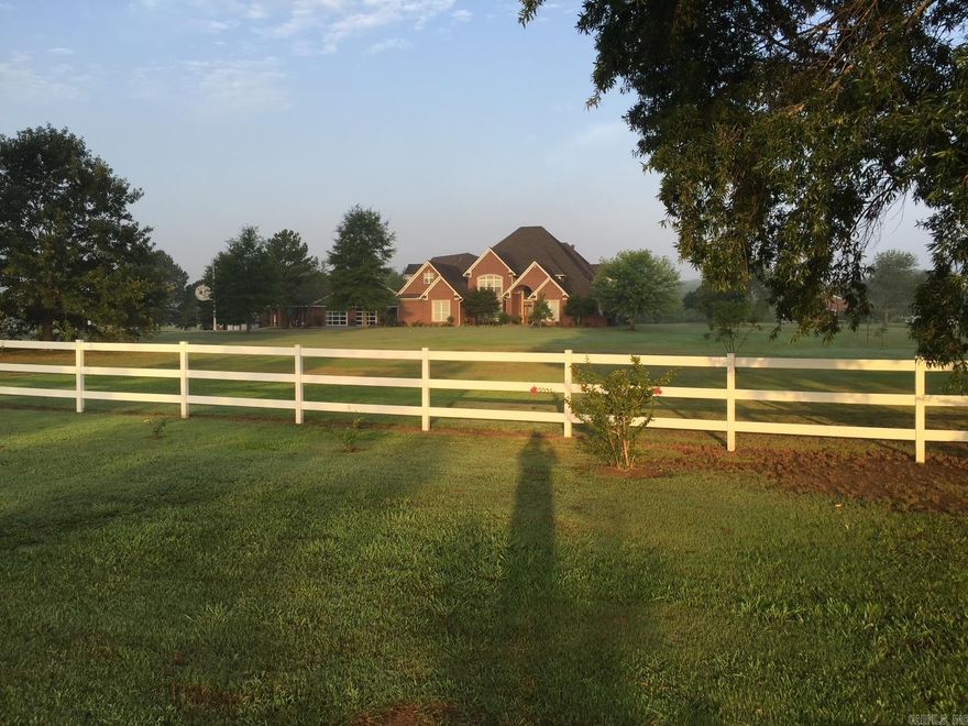 By appt only. Large house, two complete kitchens + kitchen in shop, heated floors, upstairs refrig & W/D stays, 3 living rooms 2 w/built ins, a complete 12 person theatre w/Denon, Epson,& Klipsch, small library, a big game room w/ 2 game closets, big seasonal closet, a third floor craft/sewing room, balcony overlooks back yard pond w/pavilion & year around flowing creek, 2 walkout storages, each bedroom has its own bath +two 1/2 baths. House has 4 car garage +4 wheeler parking area. Portico attaches house & working shop w/8200 Sq. Ft, HVAC, has kitchen and full bath, showroom, shop, MH garage, warehouse & parts room. Greenhouse is 25' X 34', has running water and heat.  Accessory bldg is 25' X 34' w/separate storage area for tractors, etc.,can convert to guest house. 6 acres in city limits, not in a subdivision. 7 HVAC units + 2 gas heaters, 11 garage doors. Lots of trees, white vinyl fence on front. New roofs 2024. Lots of other features not listed here. Call for list of items that do not remain.