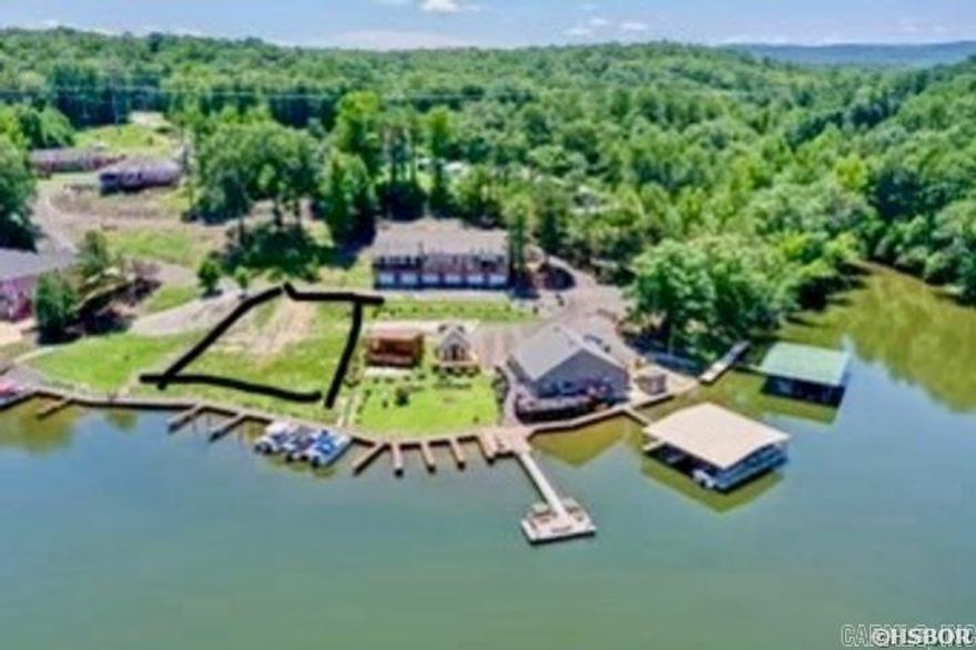 Are you prepared to create the serene lakeside retreat you've always envisioned? This exceptional buildable lot on Lake Catherine presents an incredible opportunity to bring your dream home to life! Spanning approximately 0.54 acres, this prime parcel features breathtaking panoramic views of the peaceful lake, embraced by vibrant greenery and the beauty of nature. This lot is not part of Diamondhead POA.