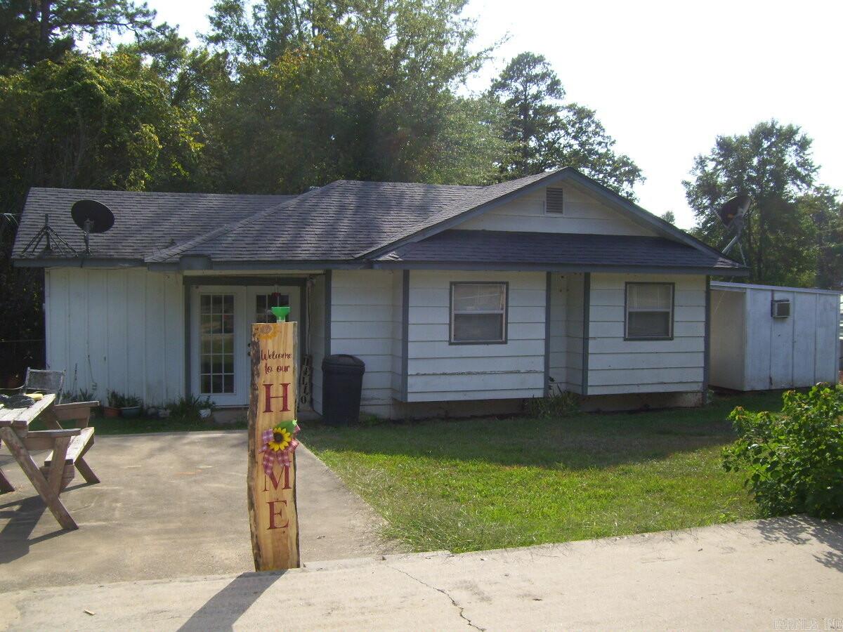 THIS HOME IS LOCATED IN A PERFECT PLACE IF YOU LIKE FISHING OR GOLF. THE GOLF COURSE IS JUST ACROSS THE STREET FROM THE DRIVEWAY AND IT IS APPROXIMATELY 3 BLOCKS TO THE BOAT RAMP AT MILLWOOD LAKE. WITH 2 BEDROOMS 1 & 1/2 BATHS, CH/A, PRETTY SUNROOM, DETACHED STORAGE AREA, LARGE METAL SHOP. ALL SITTING ON A BIG PRETTY LOT.