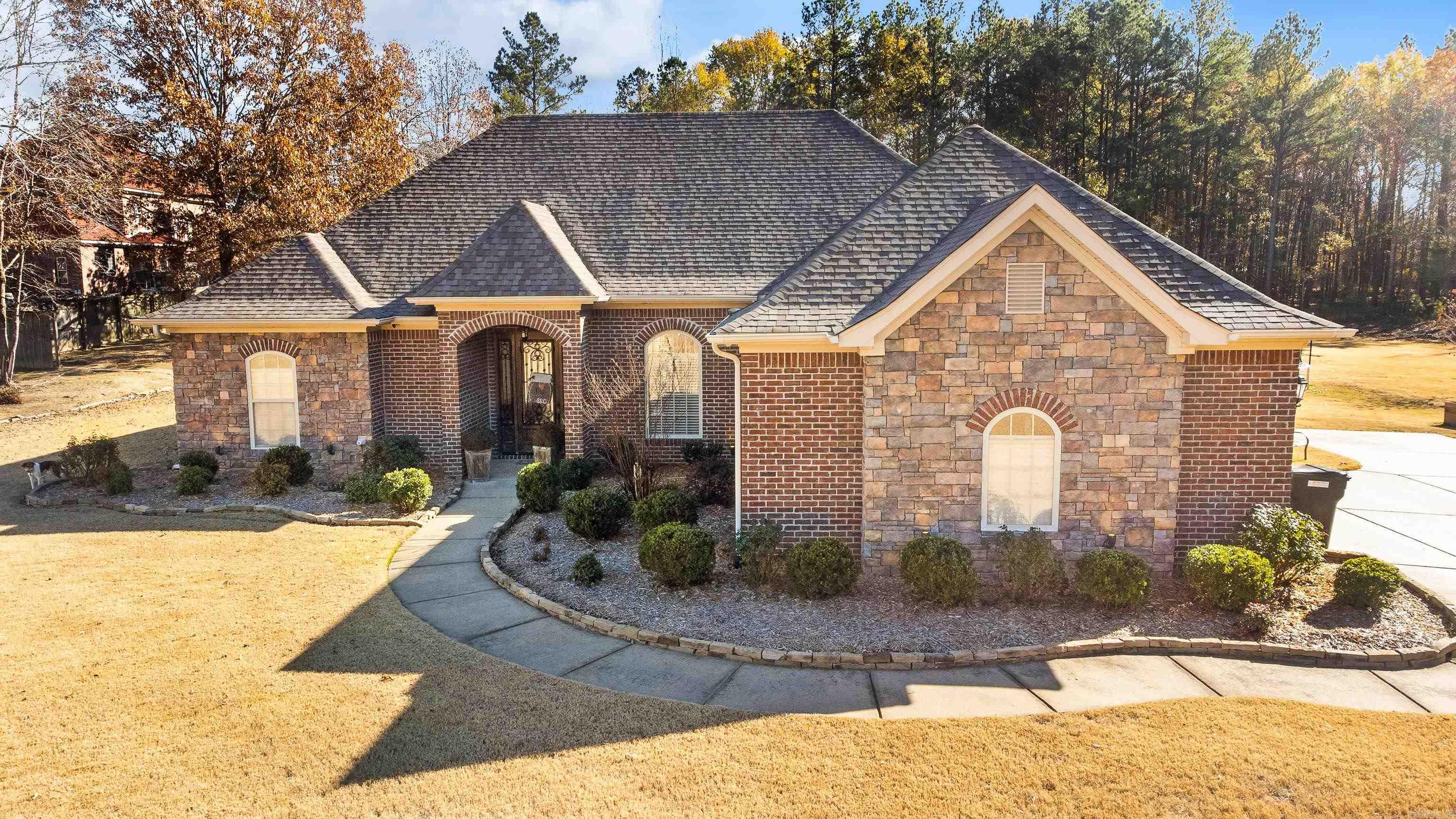 This beautiful 4-bedroom, 3-bathroom home sits on over an acre in a highly sought-after rural neighborhood. With tall ceilings and large rooms, the home is flooded with natural light, highlighting its stunning features. The spacious kitchen boasts granite countertops, tons of storage, and ample counter space, perfect for cooking and entertaining. The large primary suite includes a luxurious en suite bathroom with a soaking tub, separate shower, and walk-in closet. A cozy second living area offers additional space for relaxation. Carpeted bedrooms add warmth and comfort, while the three-car garage provides plenty of storage. Outside, the expansive lot offers privacy and room to enjoy the peaceful rural setting. This home blends modern elegance with rural charm, offering a perfect retreat.