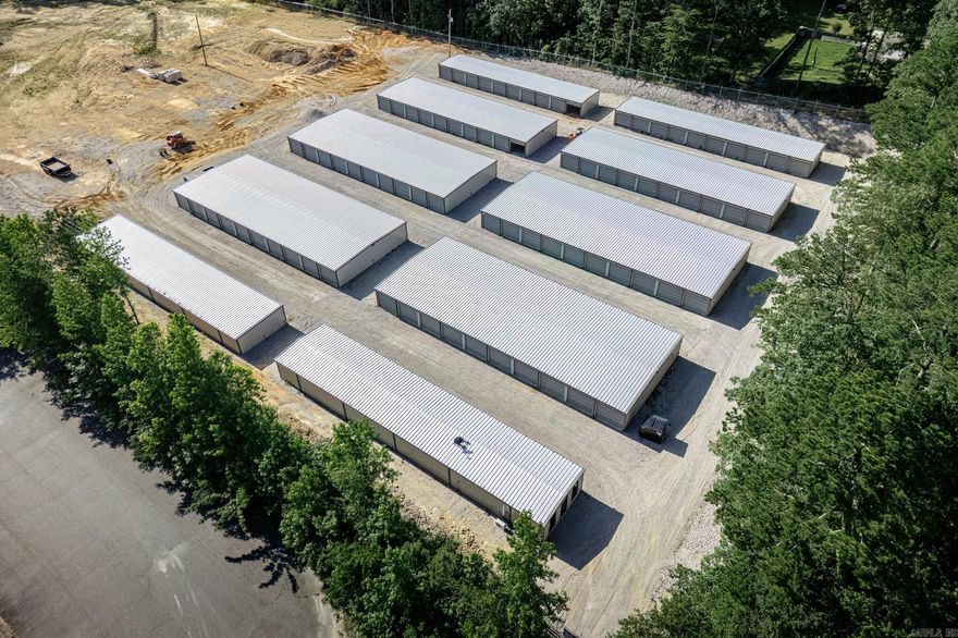 Introducing a brand new construction storage facility situated on over 5 acres of prime real estate. This state-of-the-art facility currently offers 177 storage units with the potential to expand to 577 units, accommodating a wide range of storage needs. The property is designed with security in mind, featuring 24/7 surveillance and a gated keypad entrance to ensure the safety of your belongings at all times. Whether you need storage for personal items, business inventory, or vehicles, this facility provides a secure and convenient solution. Don't miss this opportunity to utilize a top-tier storage space in a highly accessible location.
