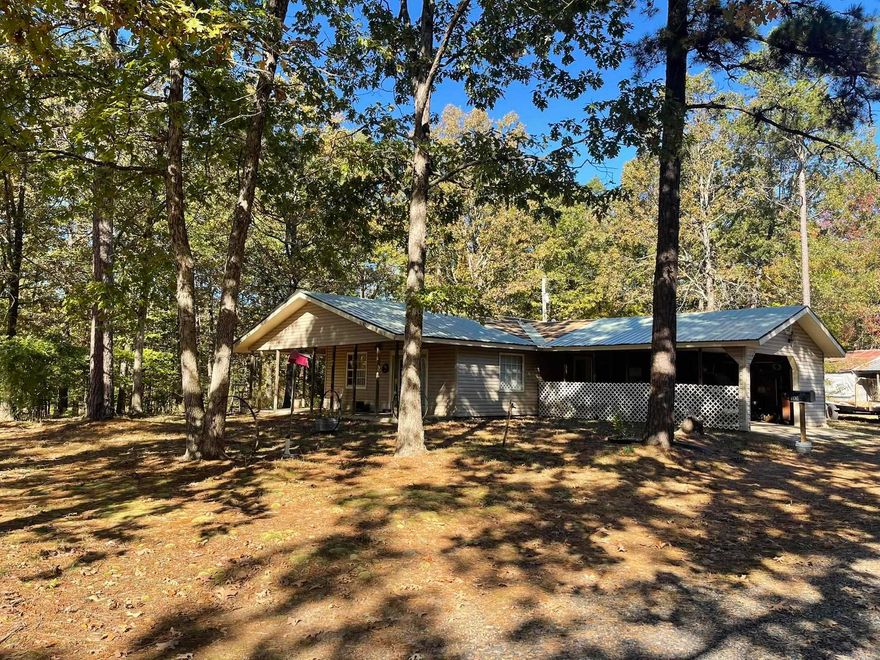 Two homes on 7.57 acres with a pond located in the beautiful Ouachita Mountains!  The main home offers 3 bedrooms, 2 baths, and 1,568 sq. ft. and includes washer, dryer, and refrigerator. A new roof is currently being installed. The second home is a 3 bedroom, 2 bath, 1,248 sq. ft. residence built in 1996 with a newer roof. Several oversized outbuildings, including a steel Quonset hut, provide abundant storage and workspace—ideal for a home-based business. This property offers a great investment opportunity for rental income or multi-family living. Enjoy peaceful country living just minutes from town.