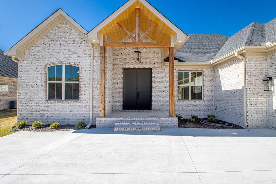 Welcome Home! WOW WOW WOW THIS IS A PRETTY ONE! Come through the double front doors and fall in love! (Easy moving in w/double doors!) Open floor plan! Gorgeous vinyl wood floors! Scratch proof! Water Proof! Sunlight floods the space! Kitchen has a pantry to get lost in! Gas stove! Granite is miles long & enough room for all the cooks! OFFICE! Breathtaking primary bathroom! Tons of decorator touches! Wood burning fireplace w/gas start! Gas logs can be added! Add this one to the list to see! Nice big private back porch for summer grilling coming just around the corner!  Storage rm in the garage! Cubbies inside the foyer across from the inside stairwell to attic storage! No more going through the garage to get there! The laundry has room for the extra fridge/freezer! Oh so nice! Side load front garage! Taxes pd on lot only. Don't pass this one by! Green space at the top of the hill will stay. At the top there is a concrete drain to catch the run off, so water coming down that hill will be minimal!