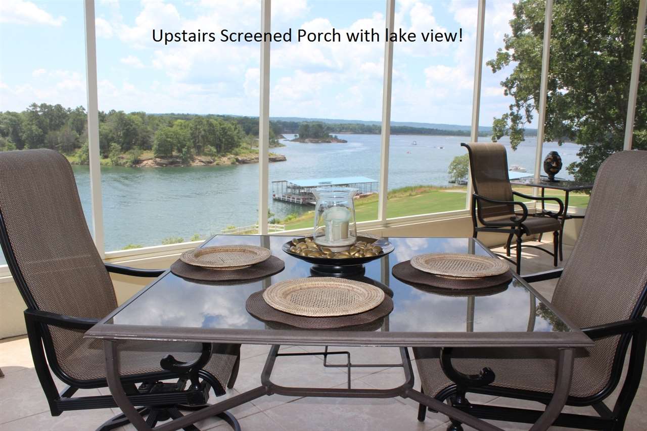 Heber Springs LAKEFRONT Home w/ MILLION DOLLAR VIEW and BOAT SLIP!! COMPLETELY FURNISHED Luxury 5,600 ft. estate in gated subdivision with spectacular views of Greers Ferry Lake! Built in 2005, 4-bedrooms (2 of which are master suites w/ exceptional closets), 4-full baths, 3-half baths, elevator, office, media room, covered & screened porch, large patio, perfect landscaping & lawn, 4-car tiled garage! This home is in absolutely perfect condition with maintenance free exterior and decking!