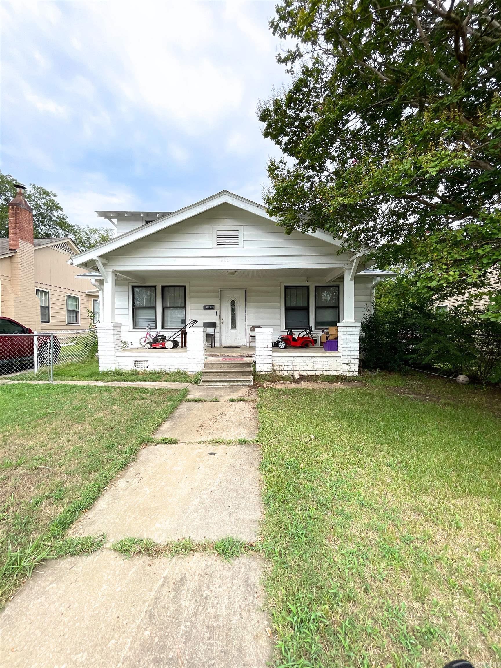 Excellent investment opportunity! This charming three-bedroom, two-bath home combines historic charm with some modern updates. This home features a large, open living space. Interior has carpet in bedrooms, hardwoods and laminate. New HVAC in 2023, renovated bathrooms and kitchen updates. Currently income producing but could be great for a primary residence as well. Being sold as is, present condition. Very motivated seller! Donāt miss this one! Investor has 2 properties for sale, and this may be combined with the other. AGENTS SEE REMARKS