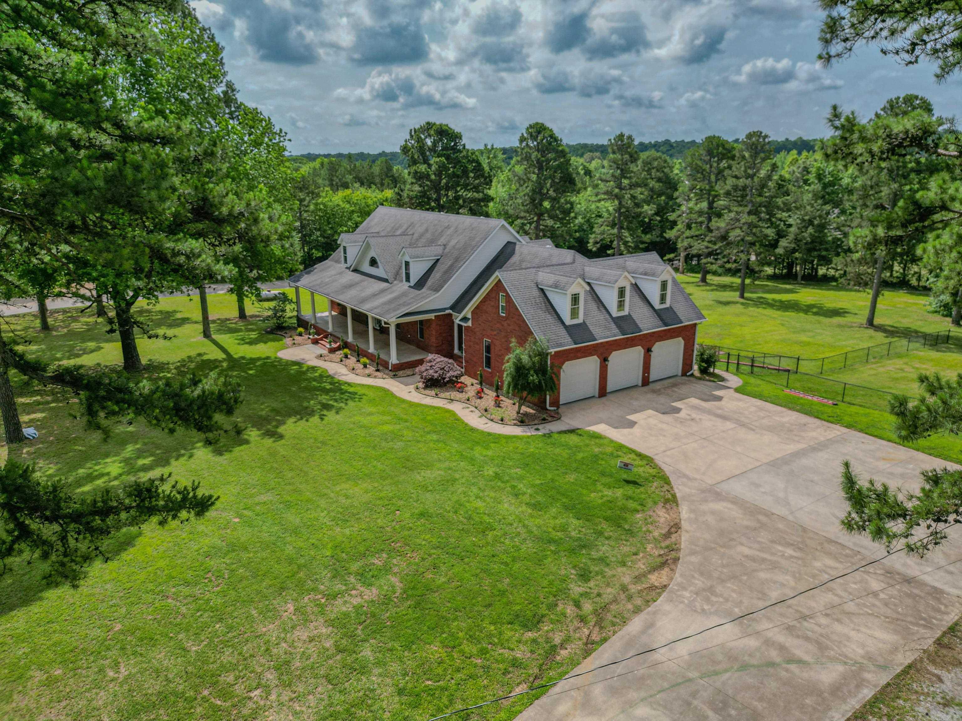 Embrace the epitome of grandeur and sophistication with this all-brick home nestled on a sprawling 3 acres of serene land. Offering an impressive 6736 sqft+/- of versatile living space, this home is designed to cater to your every need. Whether you envision a multi-generational sanctuary or the ultimate space for entertaining. Each level, including the full walk-out basement, is thoughtfully equipped with a kitchenette and bathrooms for convenience and accessibility. And for those who seek the ease of one-floor living, a fully functional elevator ensures seamless movement between floors. This is not just a home; it's a lifestyle waiting for you to define it.
