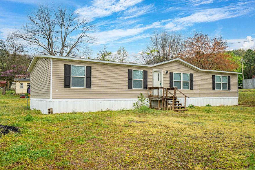 Cute 3 bedroom 2 bath on half of an acre. Lots of storage with new flooring & new paint.