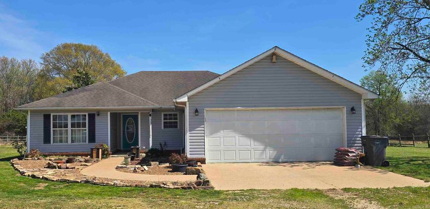 Imagine a beautiful country setting surrounded by the rolling hills of the gorgeous Ozark Mountain foothills. Cattle grazing on the surrounding farms. Serene, peaceful and beautiful. This well-maintained 1.27 +/- Acre property feels like much more when it is surrounded by family farms and ranches. Situated on the property is a charming 3 bedroom, 2 bathroom country home. Updates since the original build in 1997 include in 2022 new Central Heat & Air, in 2026 with new flooring throughout, new dishwasher and new paint. This beautiful home also features a small screened in back porch, an attached 2 car garage, an appx 12' x 12' shed with lean-to and an electric remote entry gate for privacy and security. There are several mature fruit trees and fruit plants on the property as well. Mulberry, apple, peach, pear and fig trees as well as blackberries, blueberries, grapes, strawberries and asparagus yield fruit and vegetables every year! There is an established garden spot ready for planting. This property would be perfect for the homesteader ready to grow their own food. All this plus BREATH-TAKING views! Properties like this don't come to the market often. RUN don't walk to see!