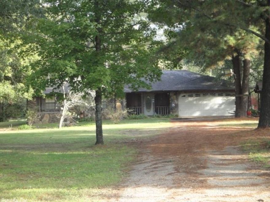 Nice rural setting just minutes from town. This rustic home has plenty of space & a deck to enjoy the pond located at back of property. Large living room with rock fireplace, spacious bedrooms, Master bath has garden style tub, breakfast area off of kitchen, - all in rustic decor. Barn shed sits beside pond with additional building playhouse also by pond.