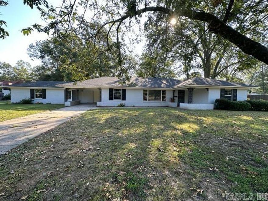 Great home in the heart of Lonoke ~ this wonderful home offers over 2,300 sq ft 3 bedroom 2.5 baths. Fresh paint, new flooring, light fixtures and many more updates!! Kitchen has lots of cabinets and breakfast area. Home office with built-ins & large living room. Large master bedroom has access to the sun porch. Bonus room off the carport with approx. 618 sq. ft. has 2 rooms and full bath. Could be used as man cave, in-law-quarters or home office, the possibilities are endless for this bonus room. This home sits on a great corner lot & is close to the park and schools.