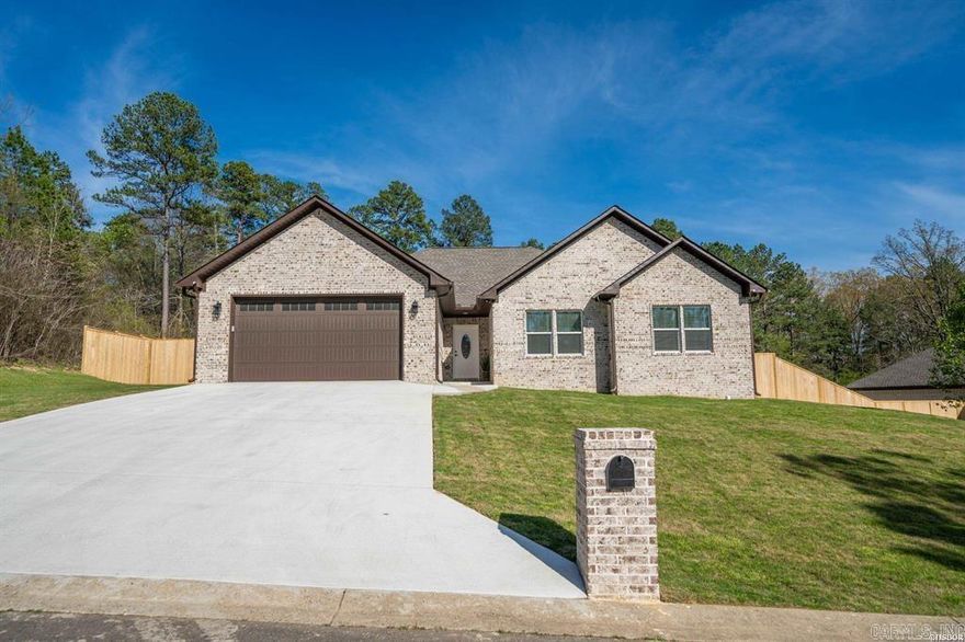 Beautiful Brick Family Home! Absolutely stunning!! Top of the line cabinets! Two tones for a one of a kind kitchen of your own with cabinets galore and a nice size pantry!  Quartz countertops!!! Beautiful transparent subway tile backsplash and gorgeous upper cabinets that go to the ceiling and transit glass doors at the top with lighting!!! Black electric surface range, Stainless appliances , dishwasher, refrigerator,  microwave wall oven with a huge breakfast bar large enough for the family to eat at, with designer pendant lighting! Dinning area has a beautiful dinning table light and bay window! Living room area has beautiful gray floors luxury laminate, also a very nice electric remote fireplace! And huge ceiling fan.  The bathrooms have Porcelain tile walk-in showers with rain water shower heads! The master bedroom has a slipper tub and a walk-in shower!  A huge master bedroom to fit all your large bedroom furniture. Each bedroom has their own bathroom and Walkin closet. The bedrooms have blinds on the windows. There is also a powder room off the front room for guest. Very nice lighting and plumbing fixtures throughout this home!  A private fenced and patio back yard