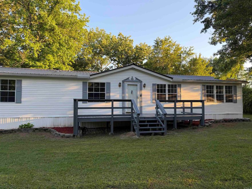 MOTIVATED SELLERY!!! Move in ready. You'll be amazed with this home with all the custom cedar woodwork. Large living room with an office space/nursery off the LR & primary suite. Speaking of the LG primary suite; the bath has double vanities, walk in shower & soaking tub. Off the kitchen is a hearth room with wood burning FP. You'll have 2 bedrooms joined by a full bath plus a guest suite. Don't miss the large laundry room. Detached 24 x 24 garage/shop and large decks on front & back on a dead end road. Bryant schools   Seller will install a Permanent Foundation with acceptable offer