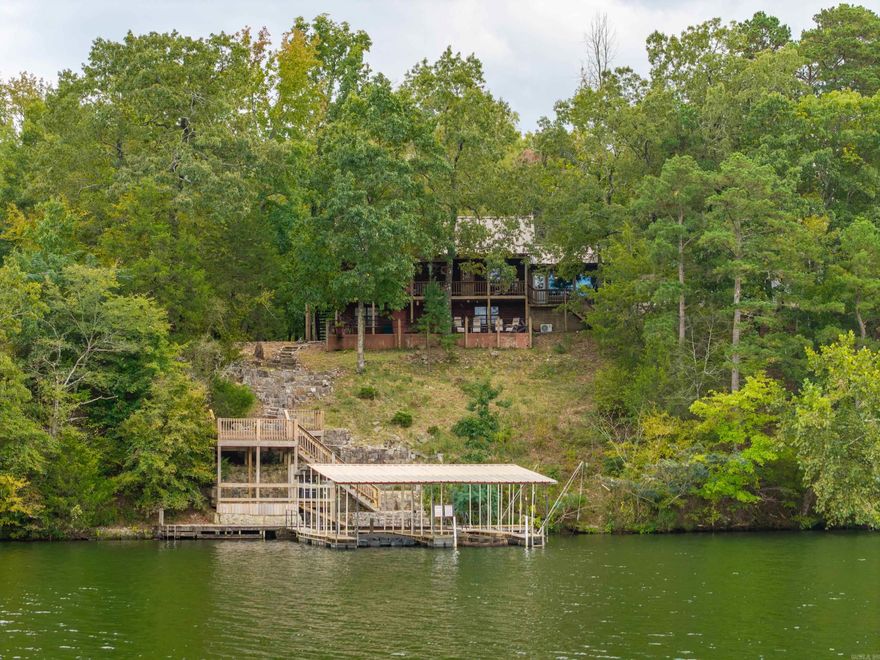 Discover lake living at its finest with this beautiful property located on Timberlake Drive in Pearcy, Arkansas. This stunning home offers comfort, space, and endless opportunities for outdoor enjoyment on the water.  The property features a spacious 60x80 shop, perfect for all your hobbies, storage, or business needs. The shop includes three 10-foot overhead doors, one 14-foot overhead door, and is wired for 220V electricity, making it ideal for RV storage, boats, or workshop use.  Enjoy lake life with your private double boat dock, offering easy access for boating, fishing, or relaxing by the water. The home itself is designed for both comfort and entertaining, with open living areas, beautiful views, and plenty of room for family and guests.   Whether you’re looking for a weekend getaway or a full-time lakefront residence, this property delivers the best of both worlds—modern convenience, incredible storage and workspace, and serene lakefront living.